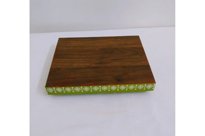 Bulk stacks of handcrafted Pichwai print wooden trays packed for wholesale orders at Puja Celebrations