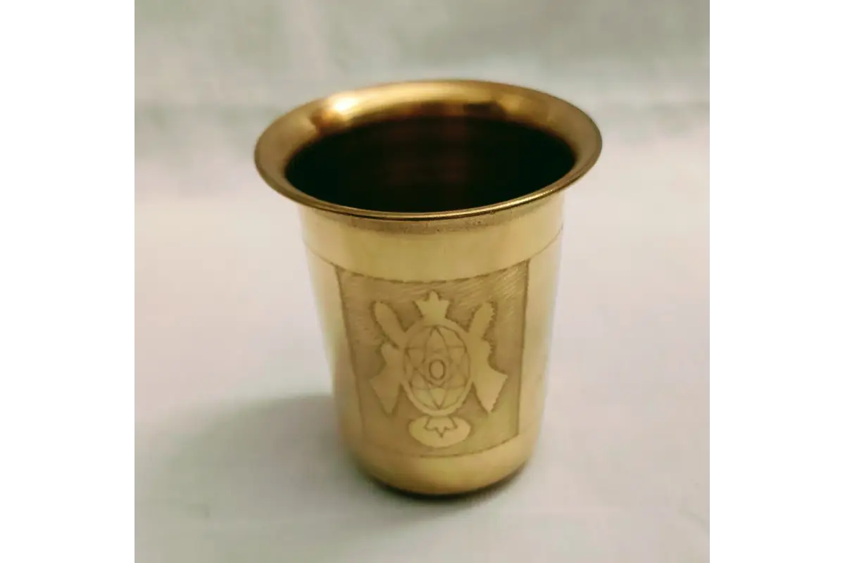 Bulk stock of traditional Shanku Chakra Namam glasses packed for wholesale return gift orders at Puja Celebrations