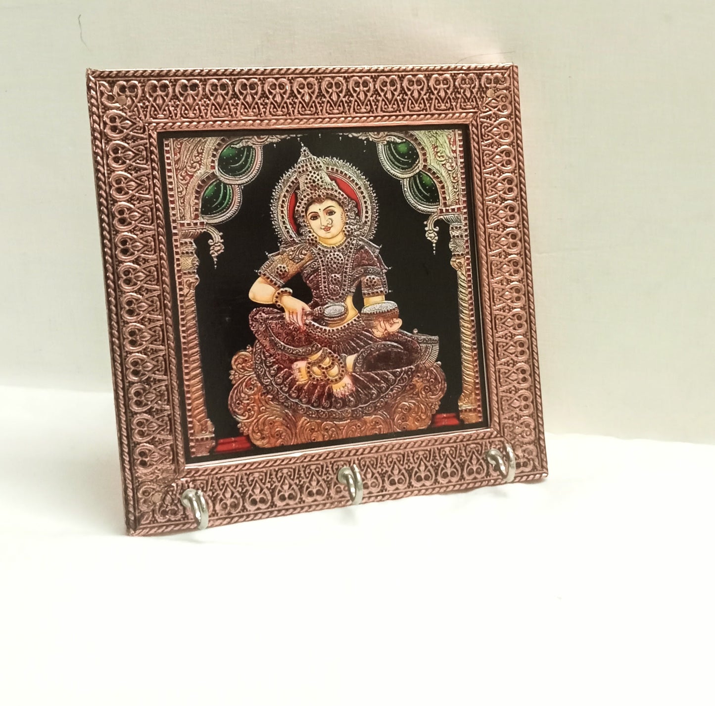 Multiple Annapoorani key holders packed as traditional return gifts for housewarming guests by Puja Celebrations