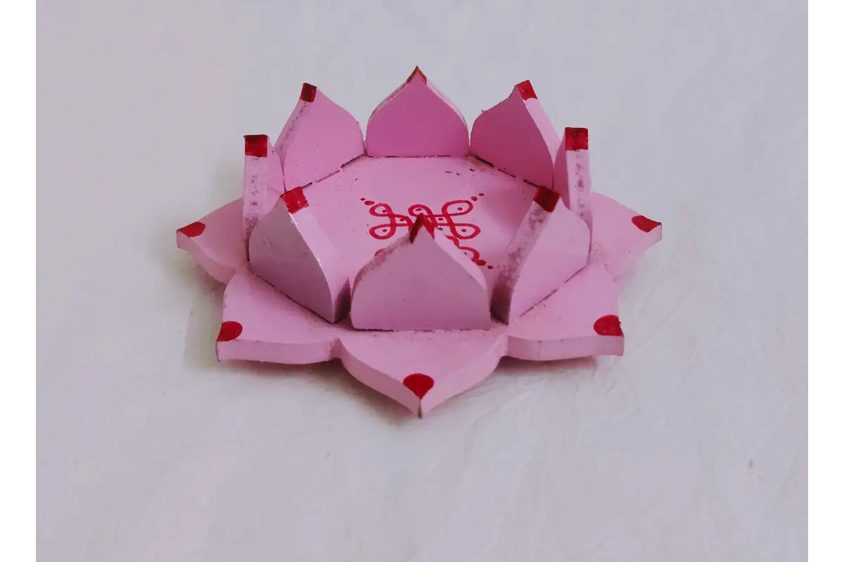 Bulk stack of wooden lotus diya holders packaged for marriage return gift delivery