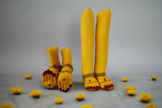 Traditional stuffed yellow fabric deity hands and legs pinned onto a draped silk saree for Varalakshmi Viratam